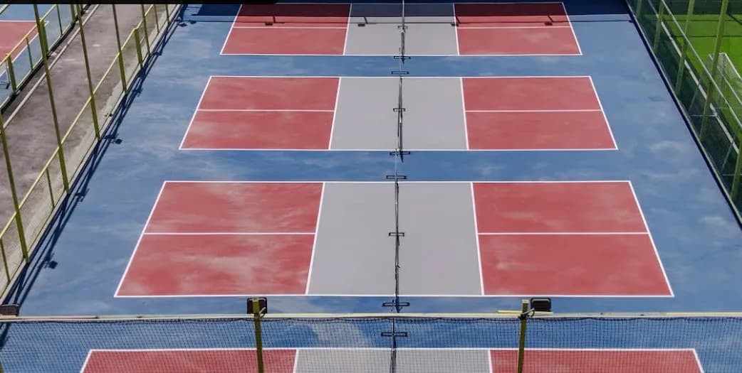 Aerial view of five pickleball courts at Coliseo Nice Road