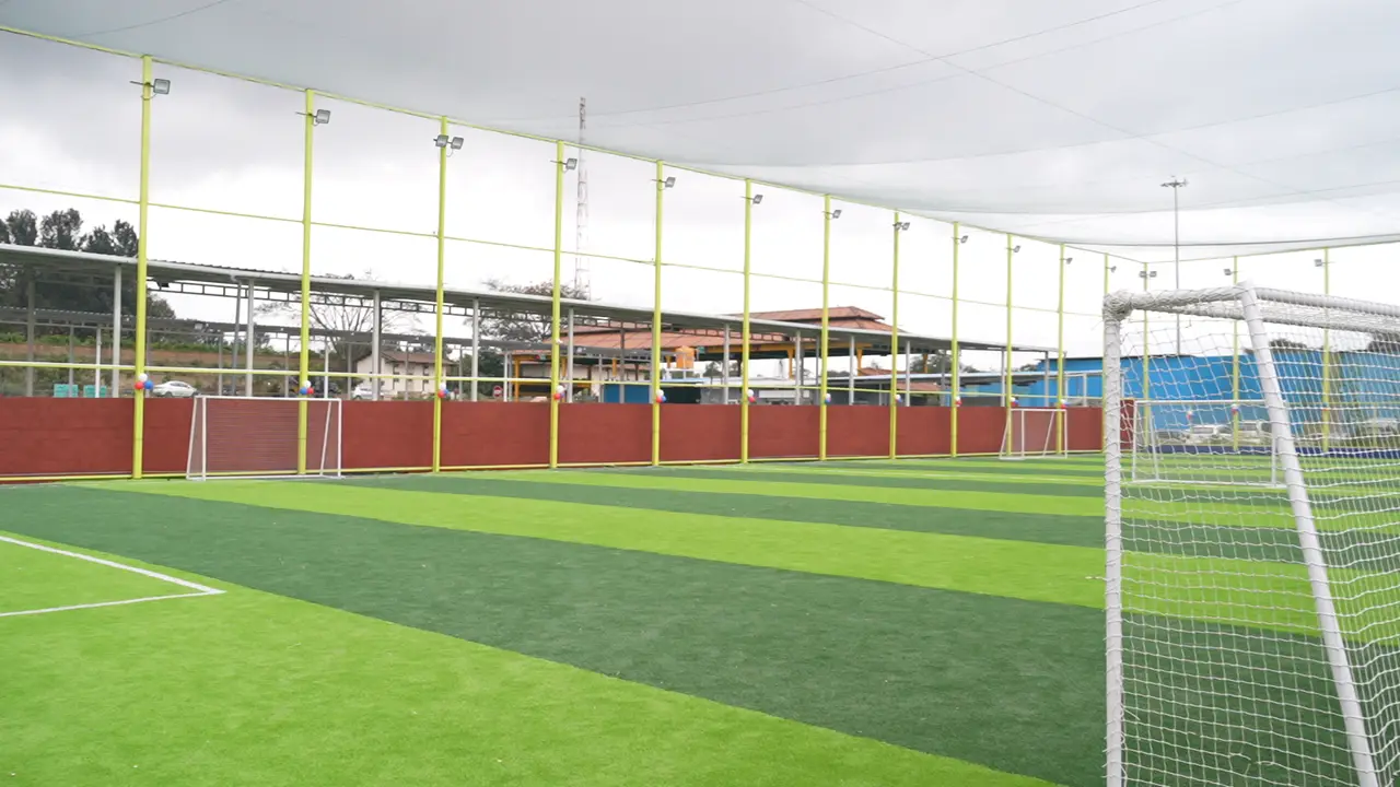 The floodlit football turf at Coliseo Nice Road Junction